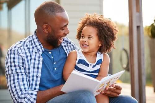 Single dad reading to daughter.