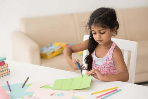 A girl cutting paper.