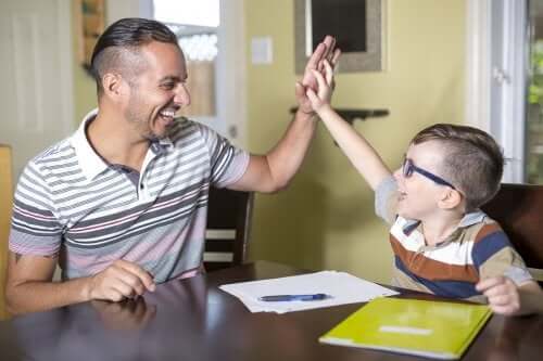 A father helping his son with his homework.