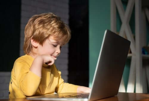 A boy using a laptop.