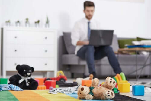 A man working in his living room.