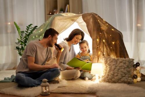 A family reading in a fort.