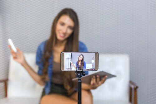 A teen recording a video.