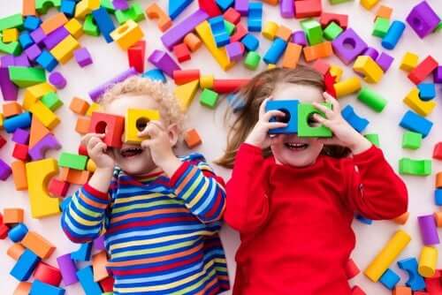 Toddlers playing with blocks.
