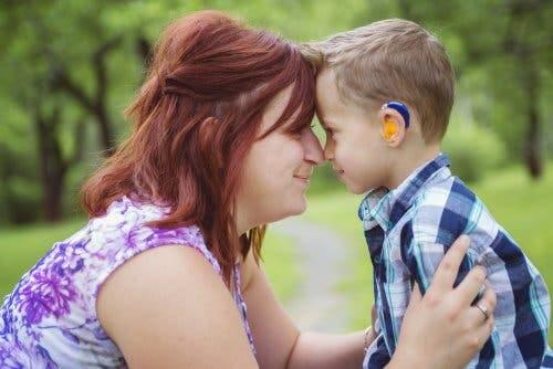 A mother with her son who has hearing problems.