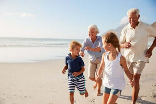 Grandparents and grandchildren on the beach.