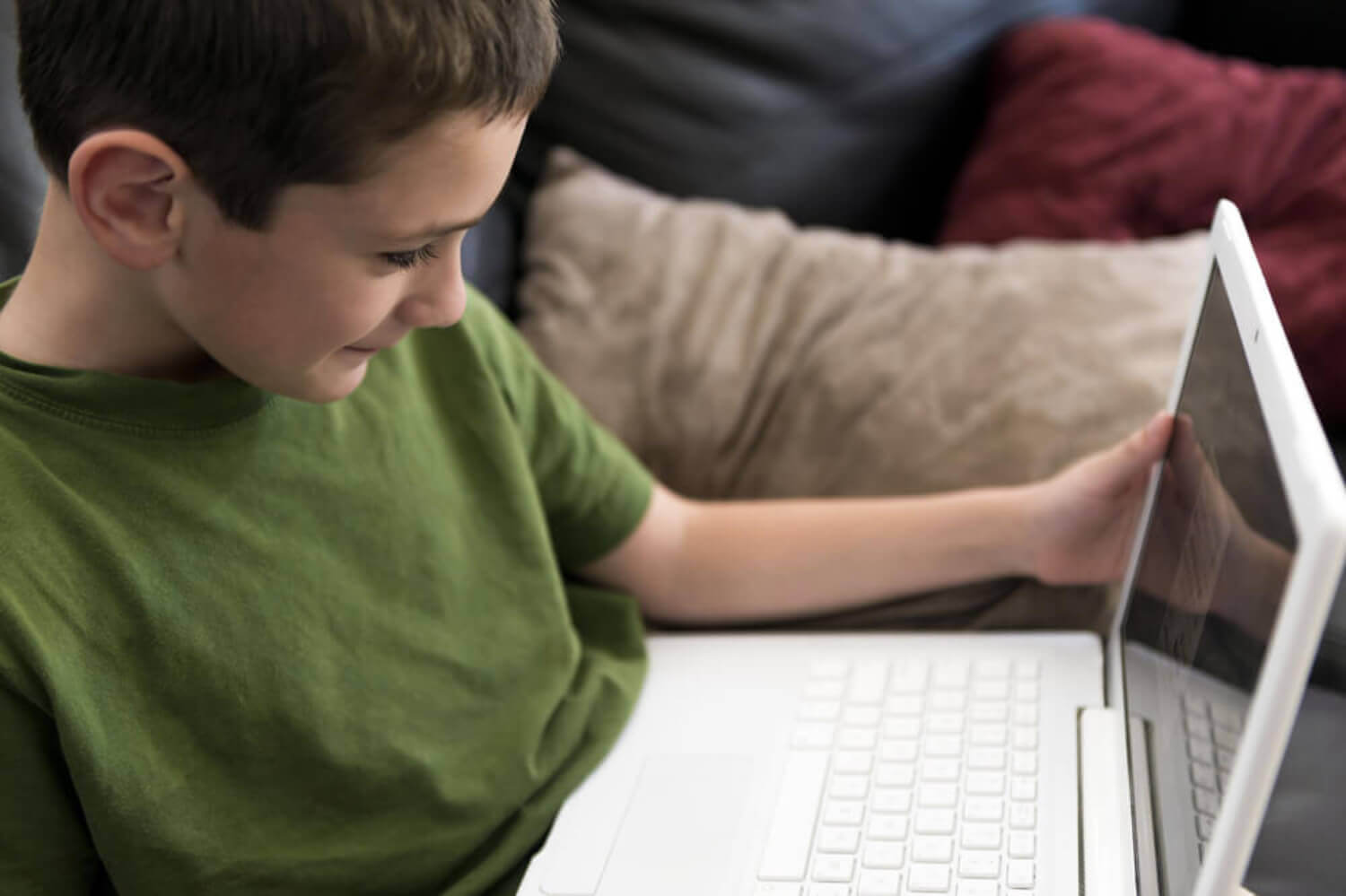 A boy on a laptop.