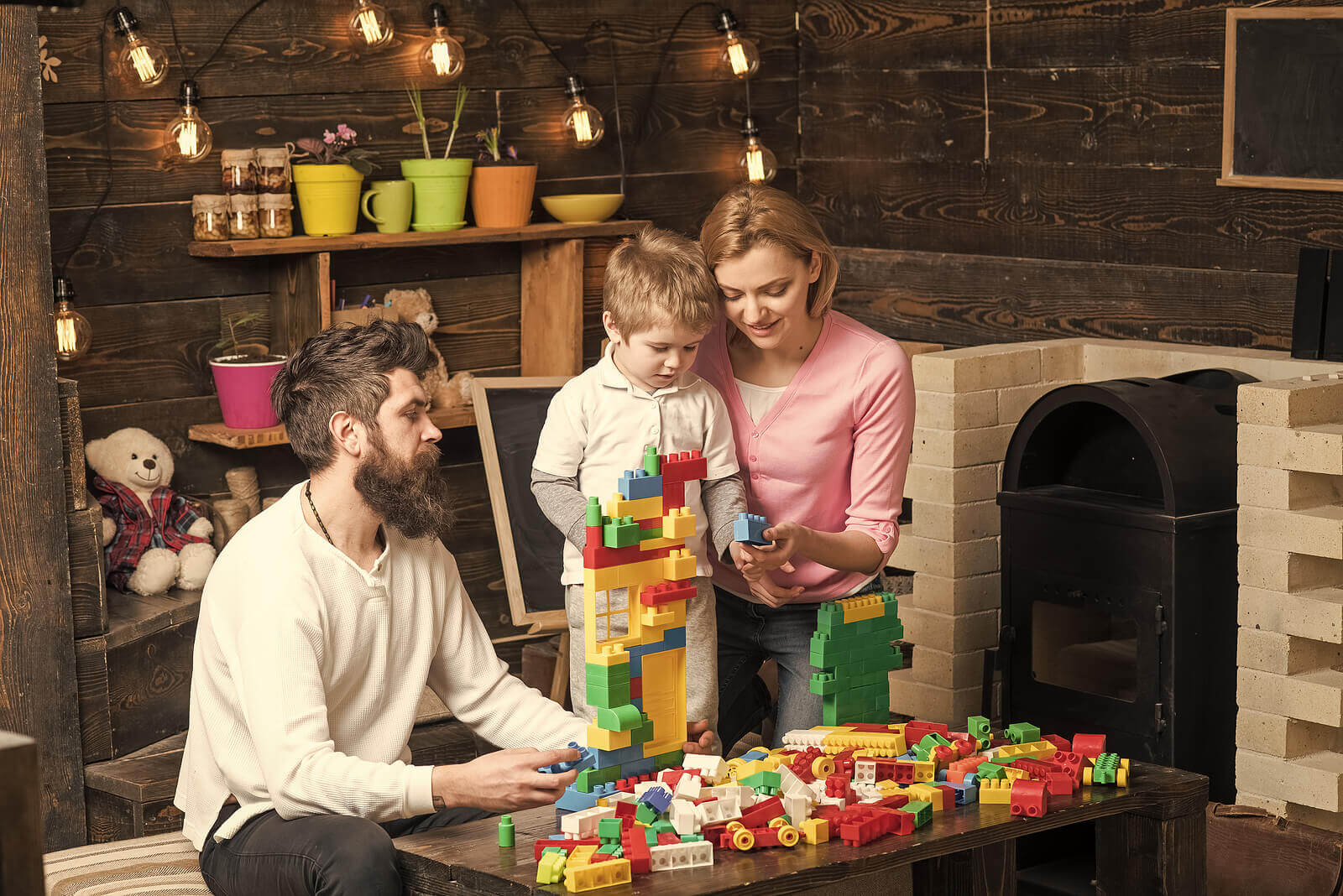 A family playing with LEGO.
