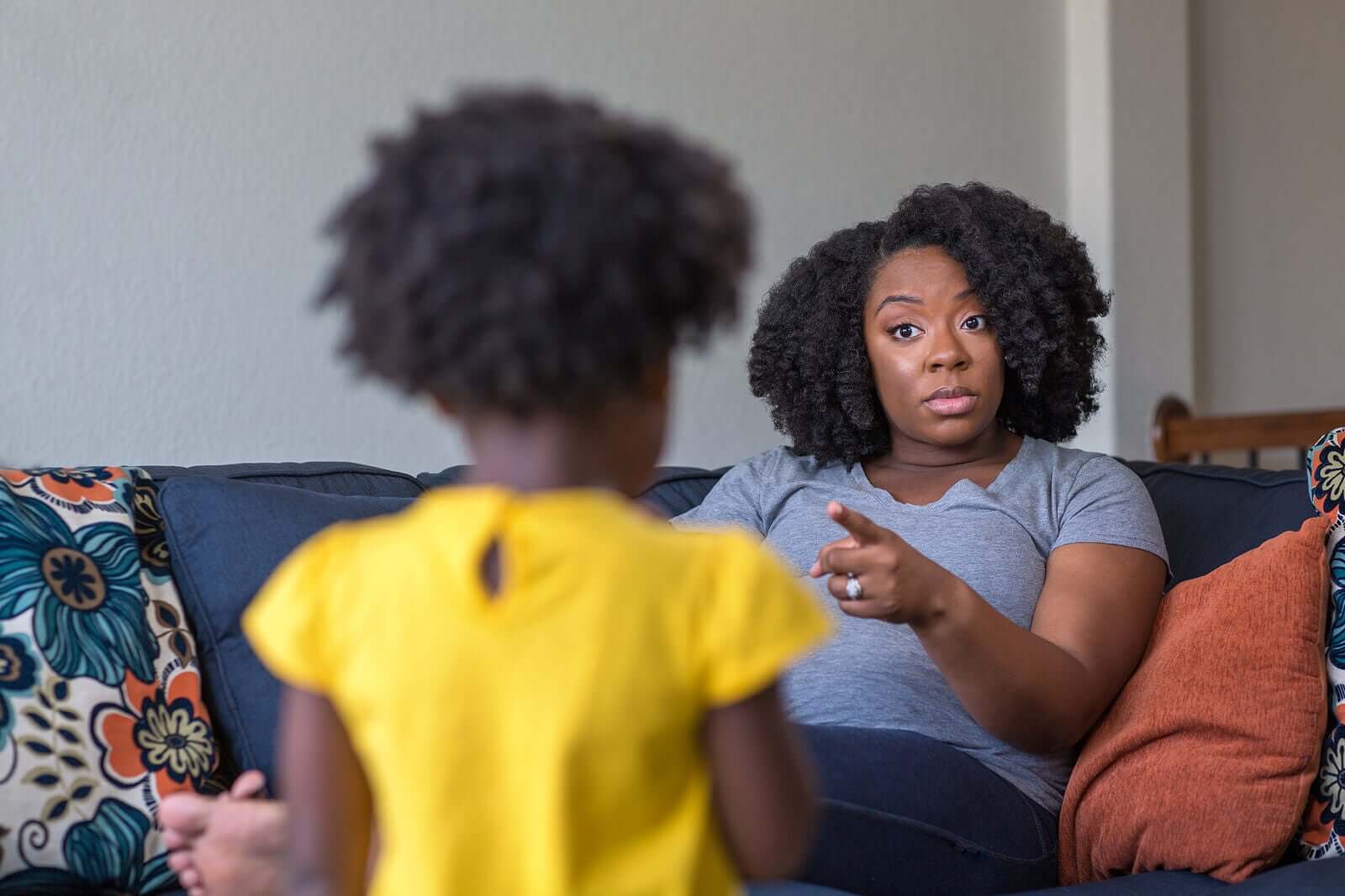A mother telling her child off.