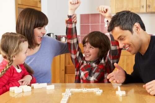 Family playing dominoes.