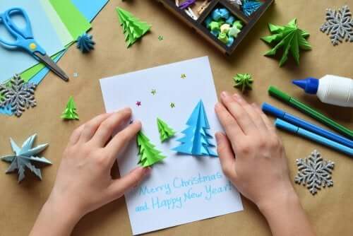 A child making a homemade christmas card.