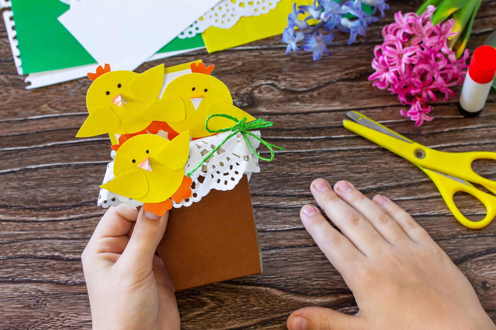 Paper chicks in a paper basket.