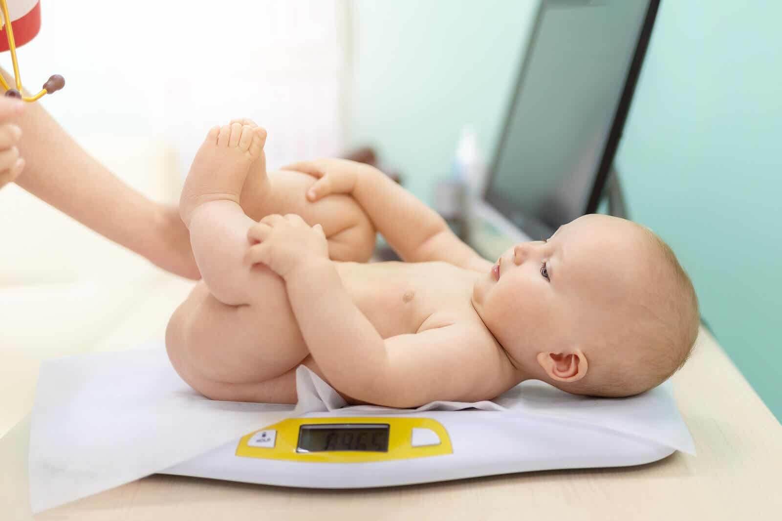 Baby at the pediatrician to check weight and height.