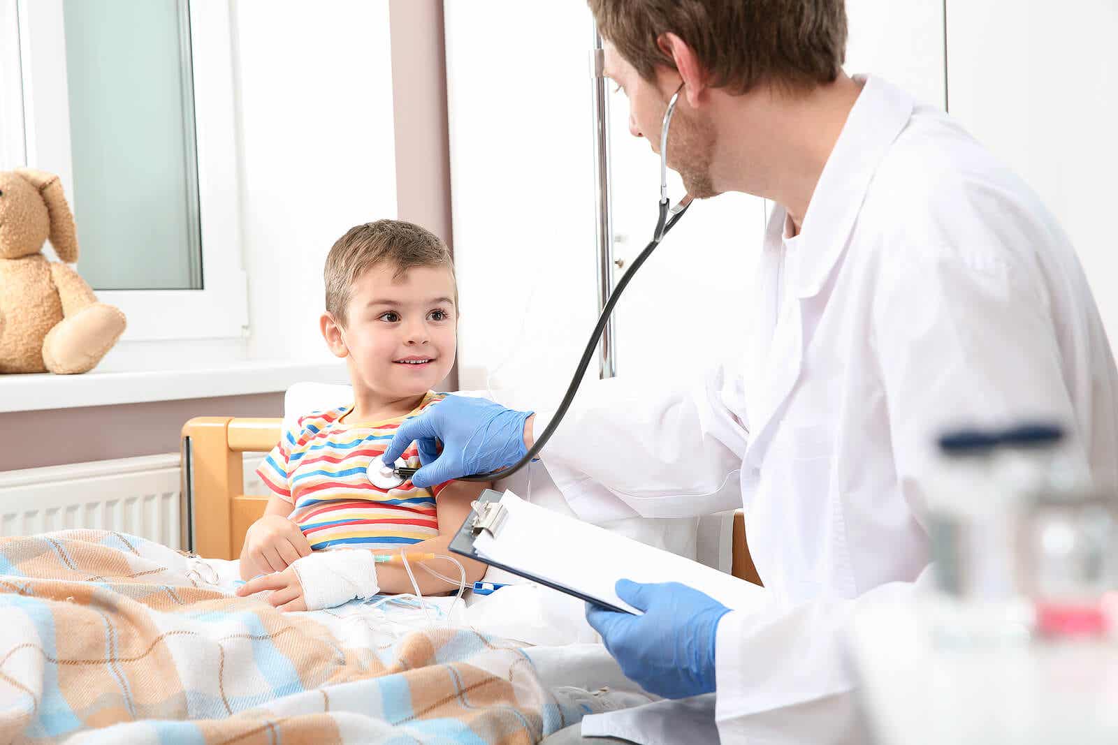 A doctor listening to a child's heart in a hospital room.
