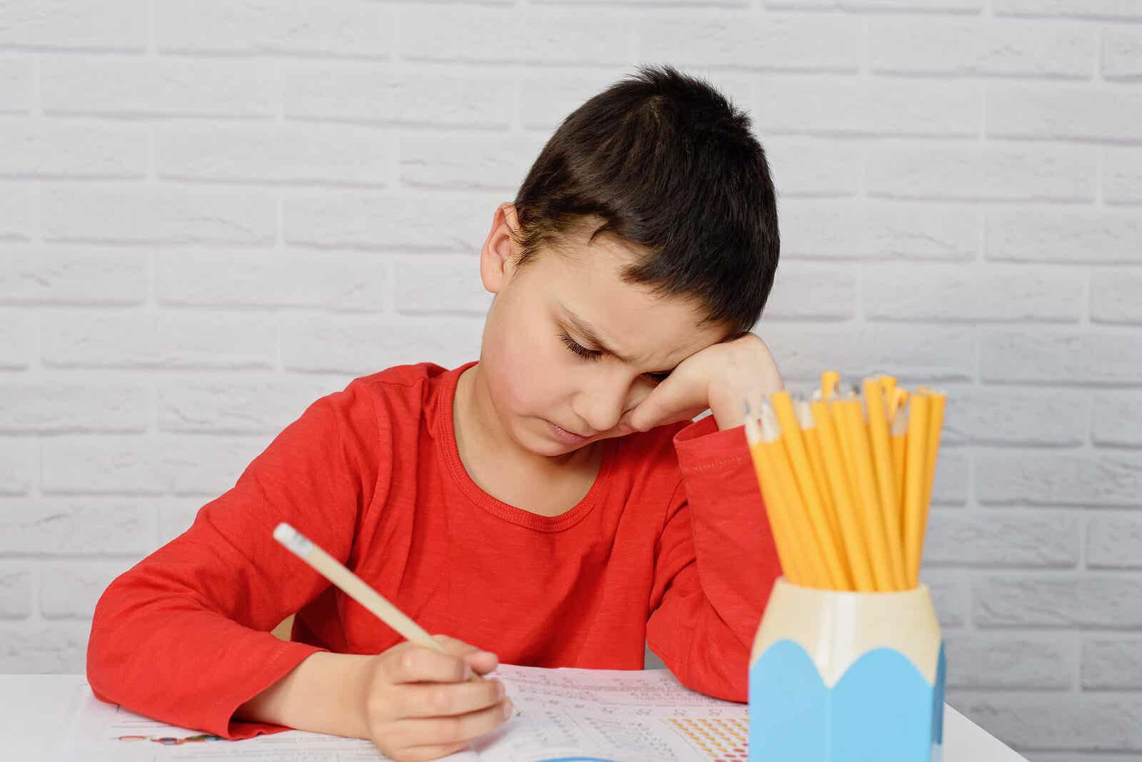 Homework boring. A schoolboy with a Pen.