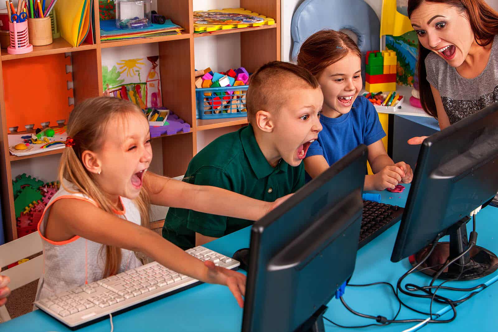 Elementary students excited to learn on computers.