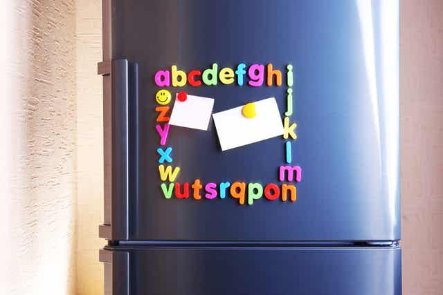 Alphabet magnets on the fridge.