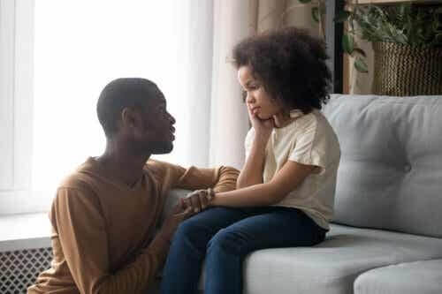 Father talking to his daughter about how to cope with the loss of a friend.