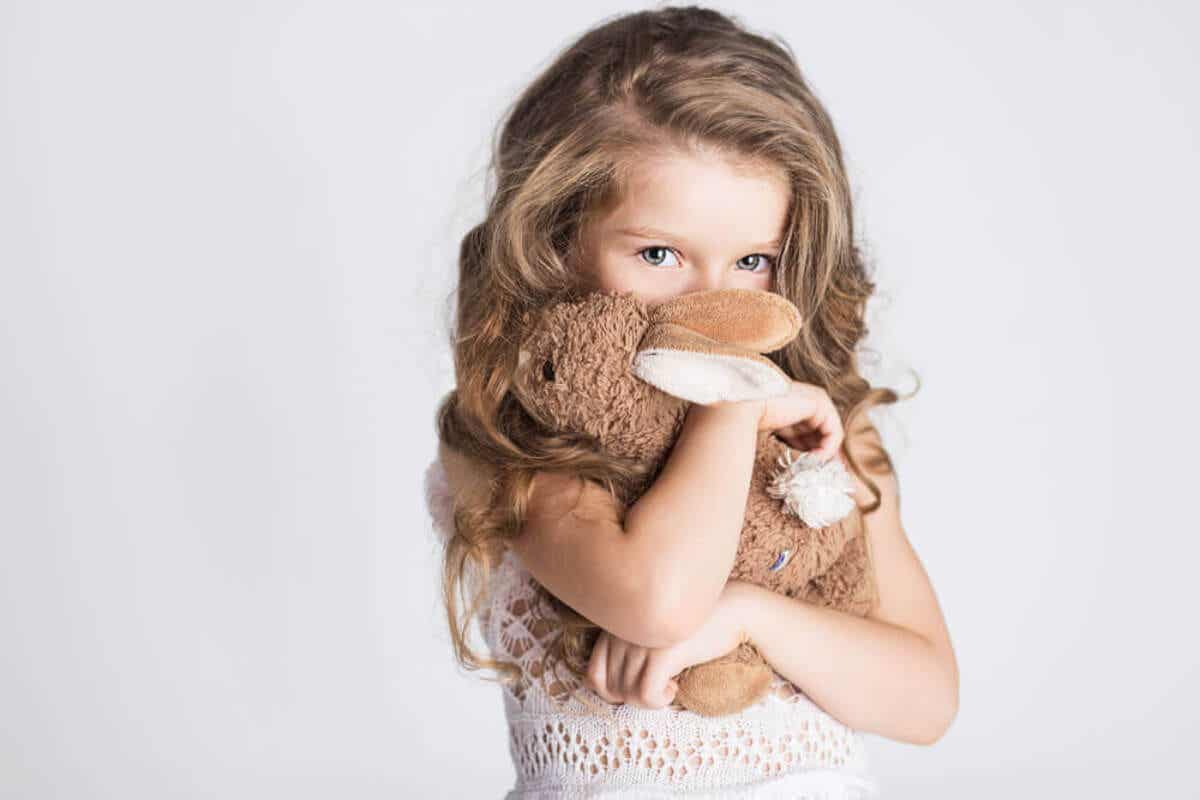 A girl with soft toy.