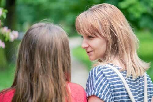 Mother talking to her daughter to help her cope with the loss of a friend.