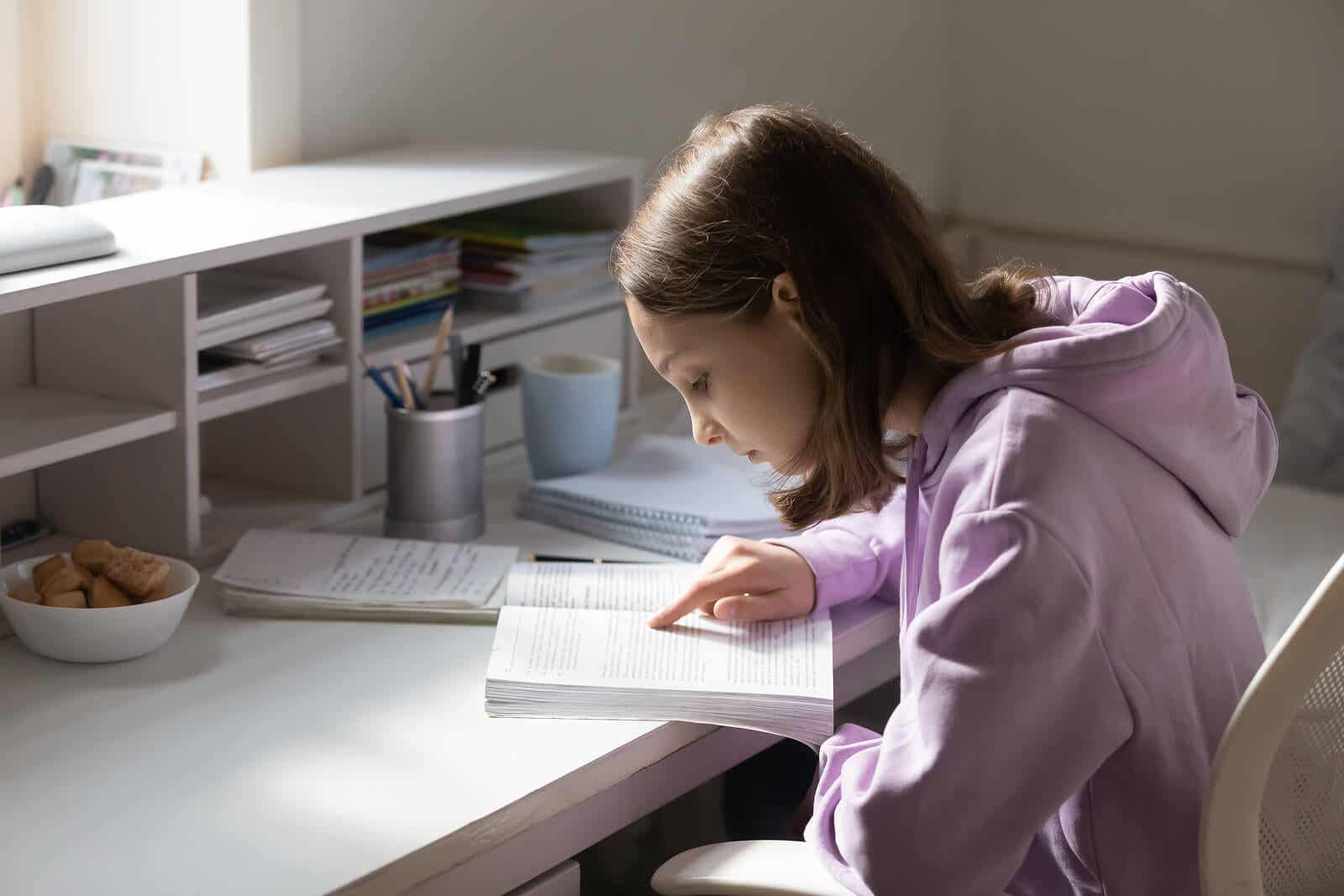 Teenage girl in her room studying because she trusts her own judgment.