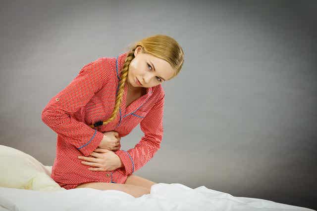 A teenage girl having cramps.