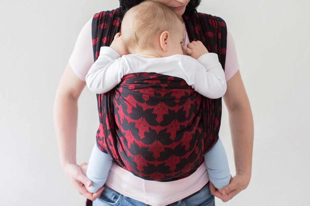 Parent carrying baby.