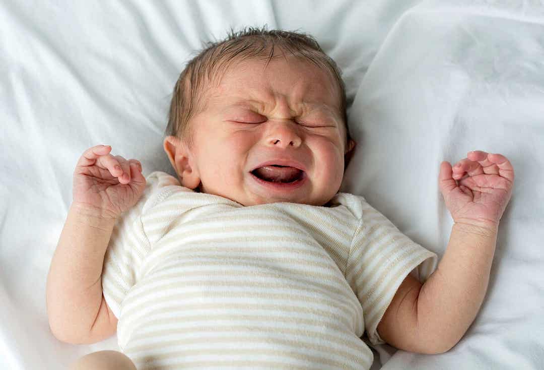A newborn crying.
