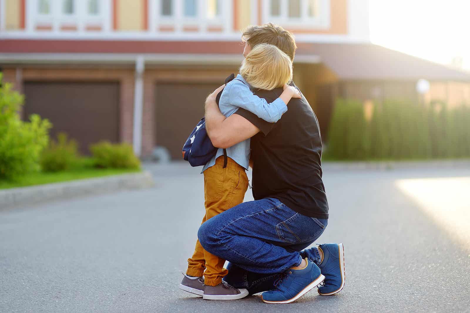 A father hugging his dad because he doesn't want to go to school.