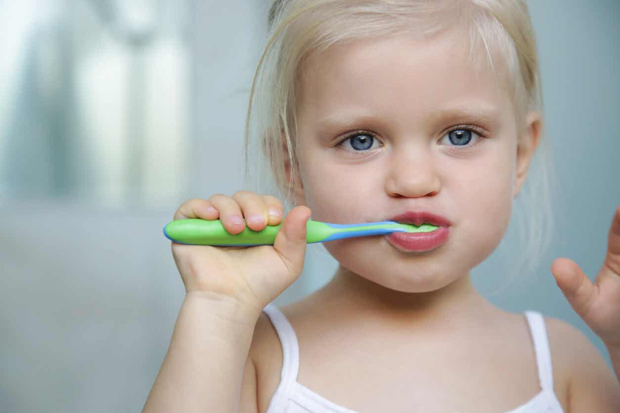 Girl brushing her teeth.
