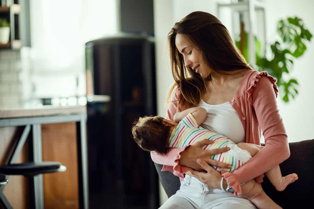 A mother breastfeeding her newborn.