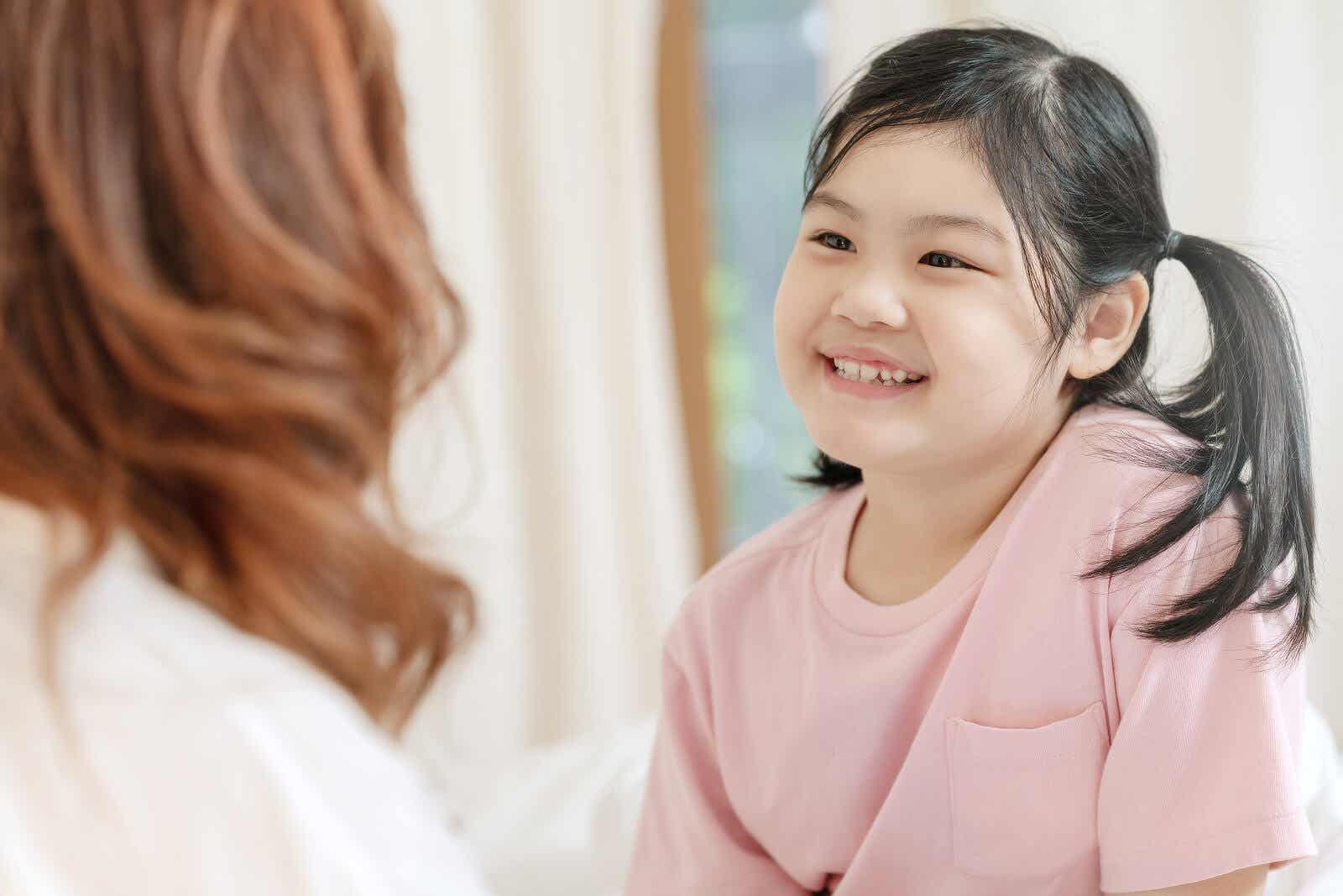 A young girl with a proud smile on her face.