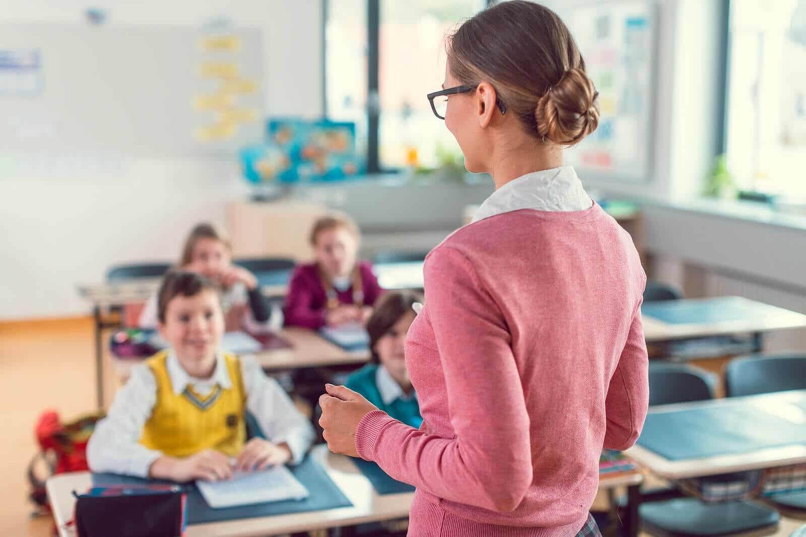 Teacher teaching her students.