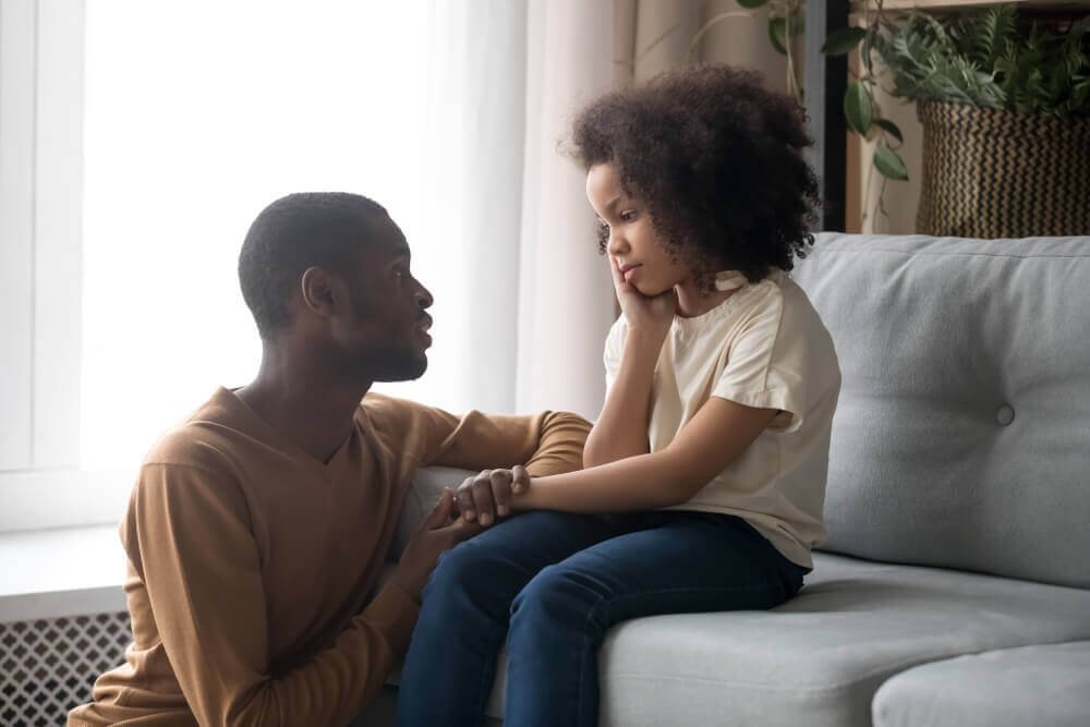A father and daughter talking.