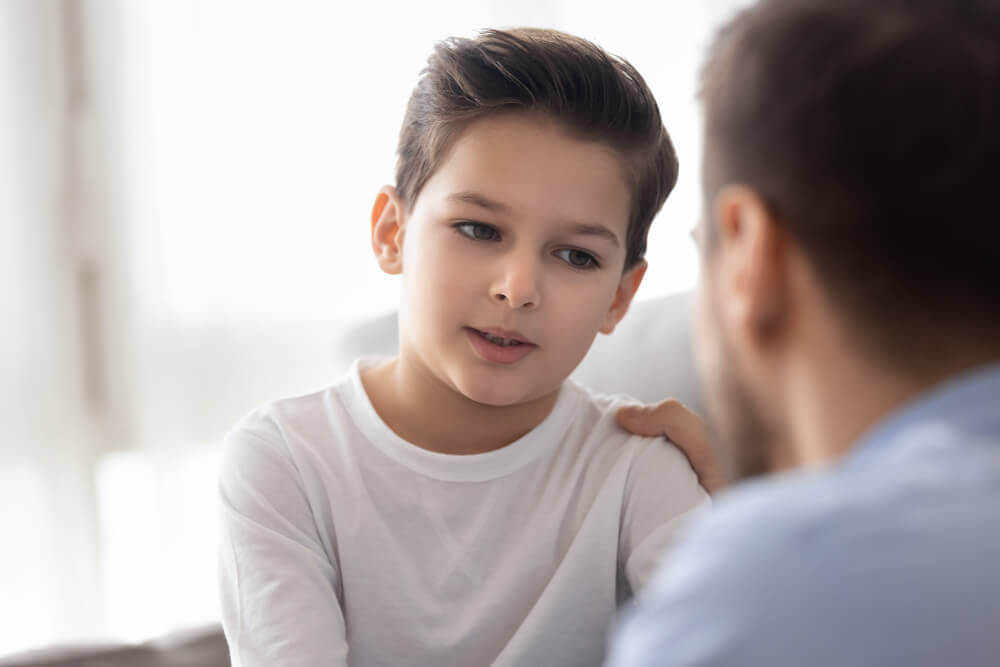 A father and son talking.