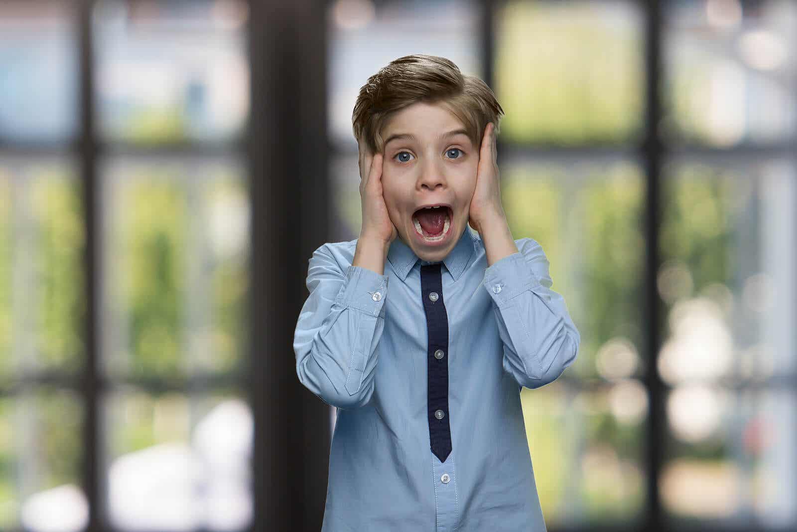 A young boy screaming with fear.
