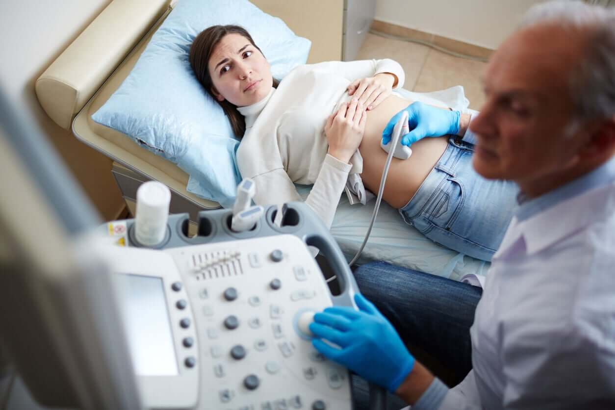 A pregnant woman getting an ultrasound.