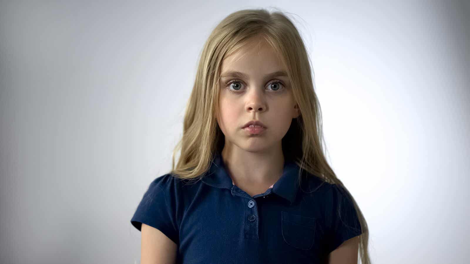 A young girl frozen with fear.