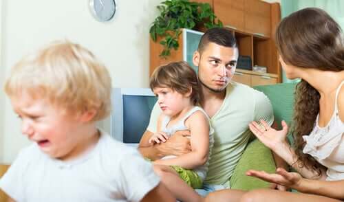 Parents arguing in front of their children because they're stressed.