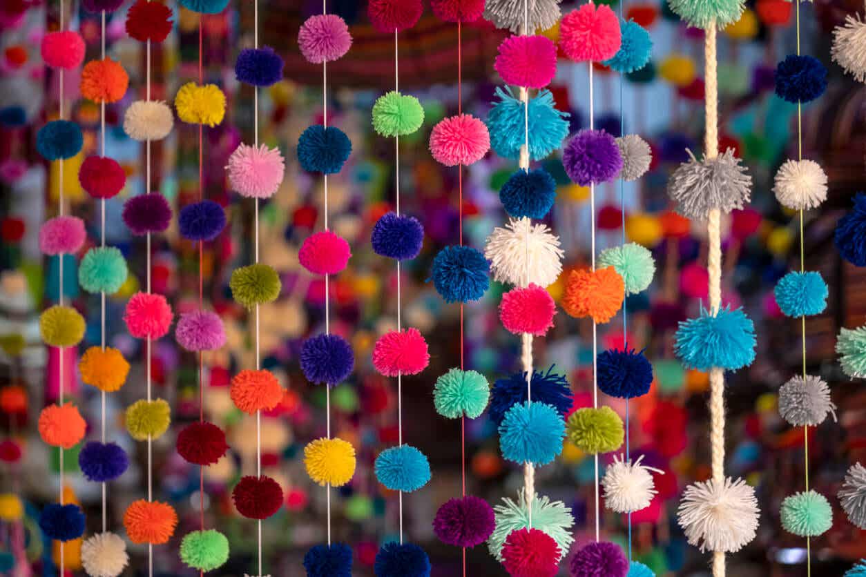 Pom-pom garlands hanging from the ceiling.