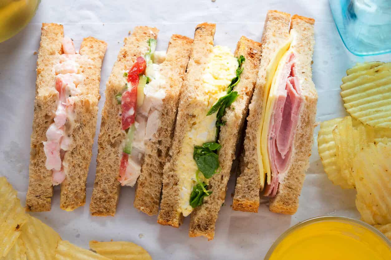 Sandwiches cut into triangle-shaped quarters.
