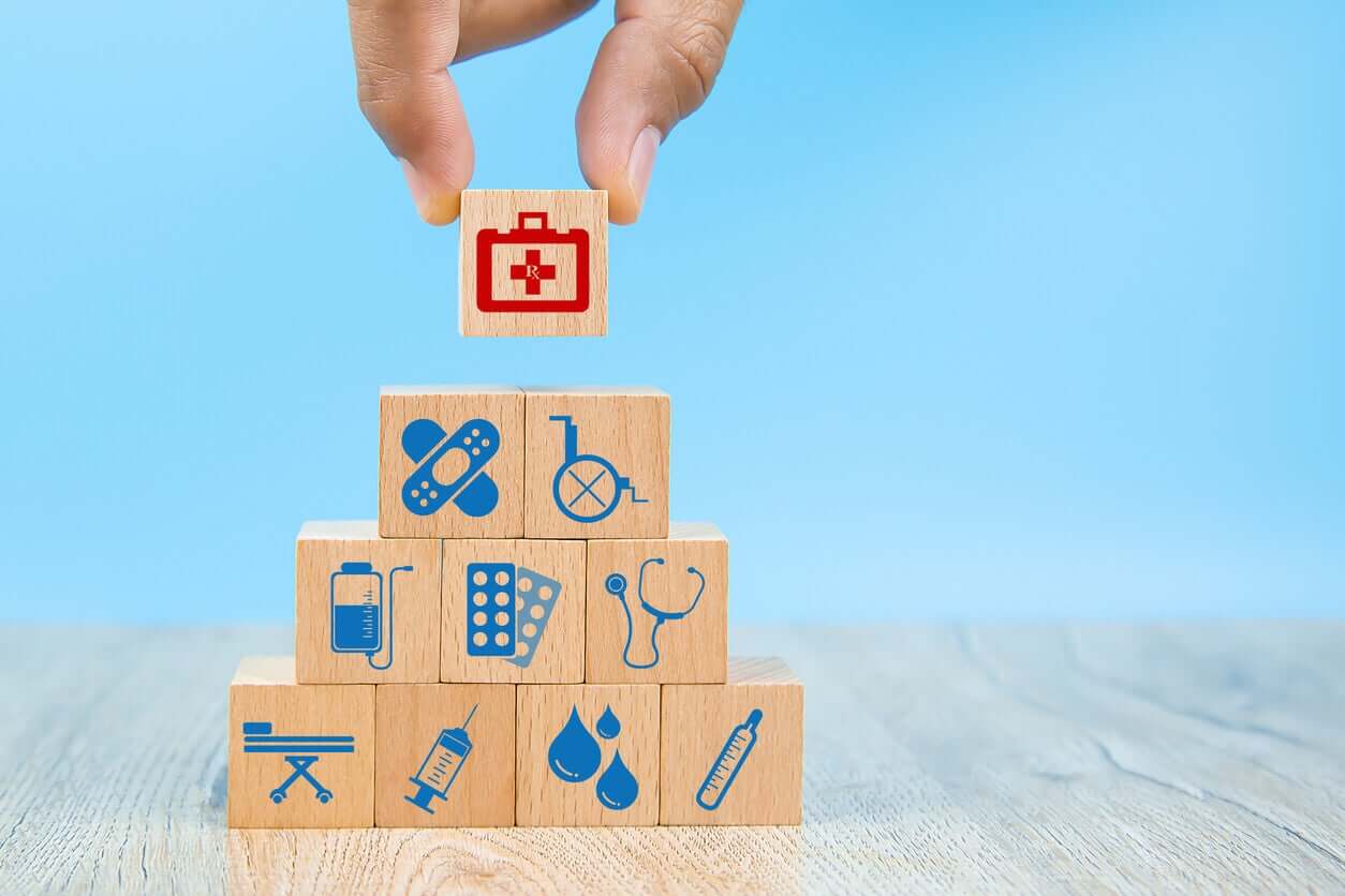 Building blocks with different health-related images on them.