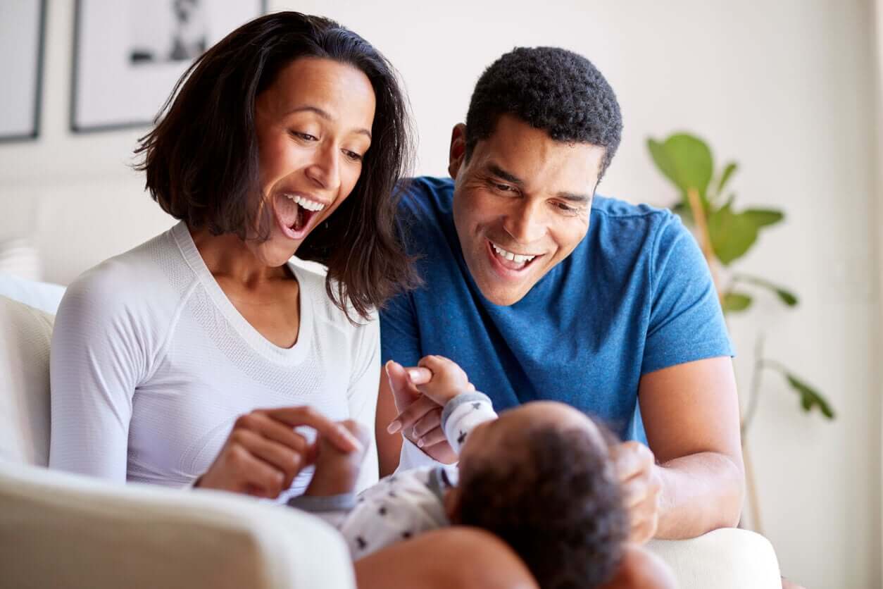 Parents playing with their baby.