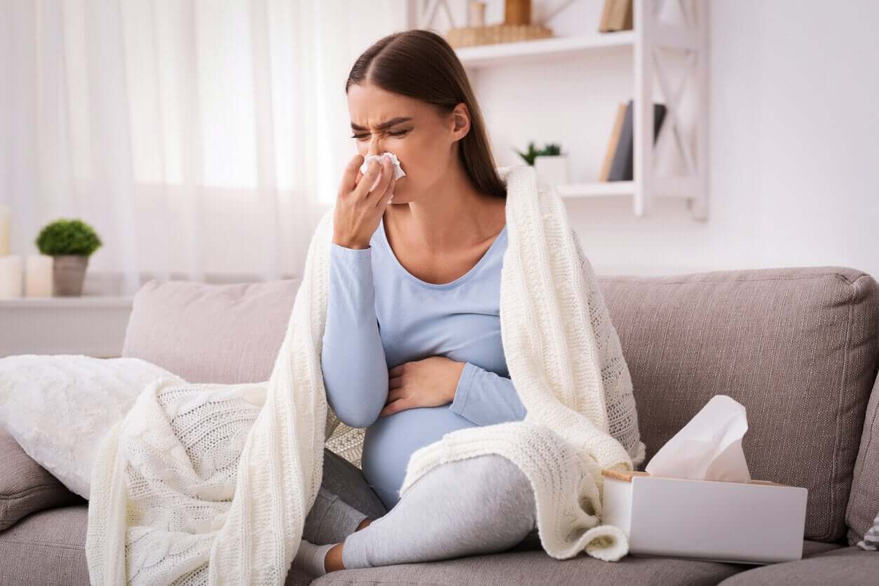 A pregnant woman with a runny nose.