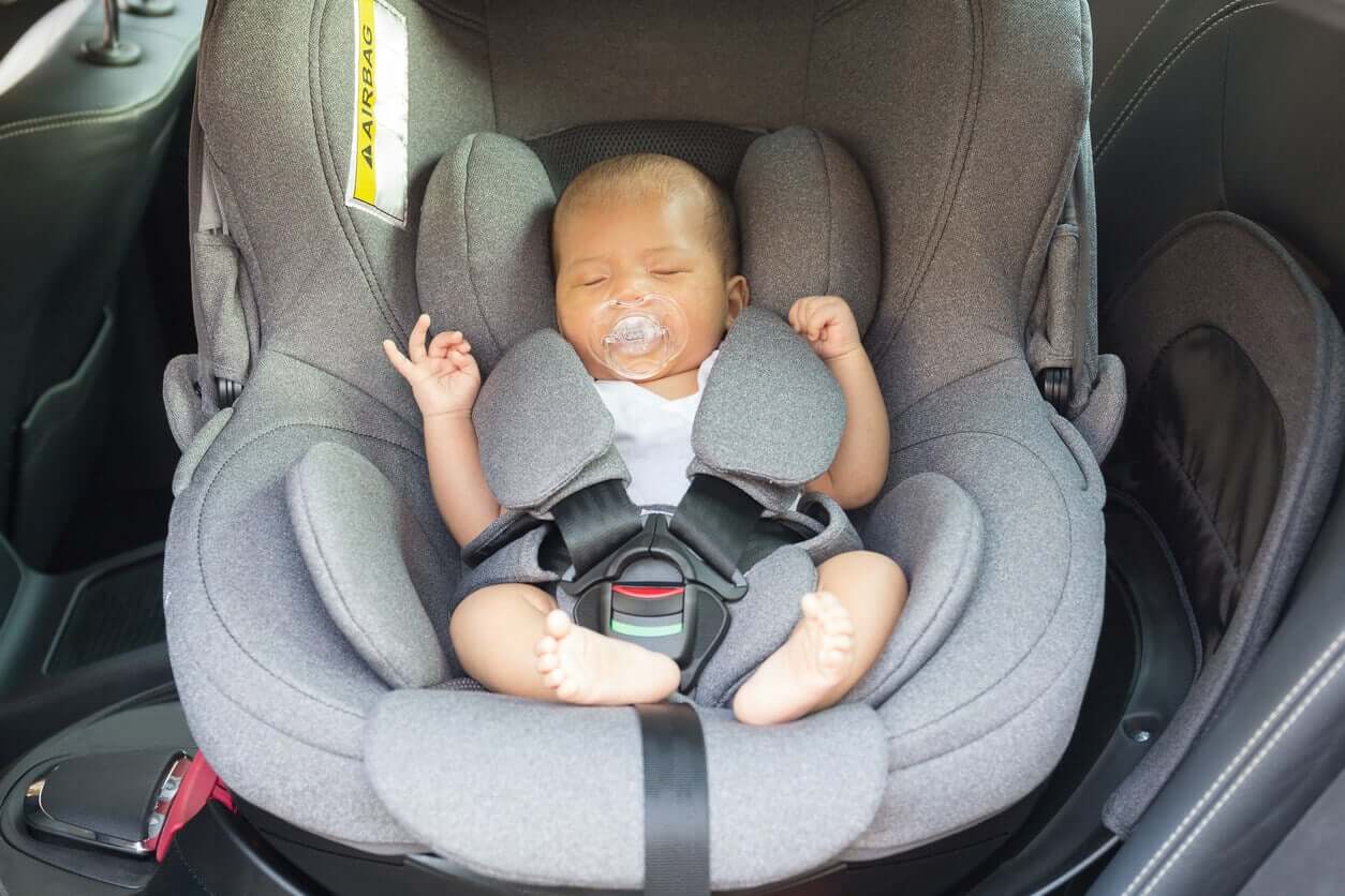 A newborn in a car seat.
