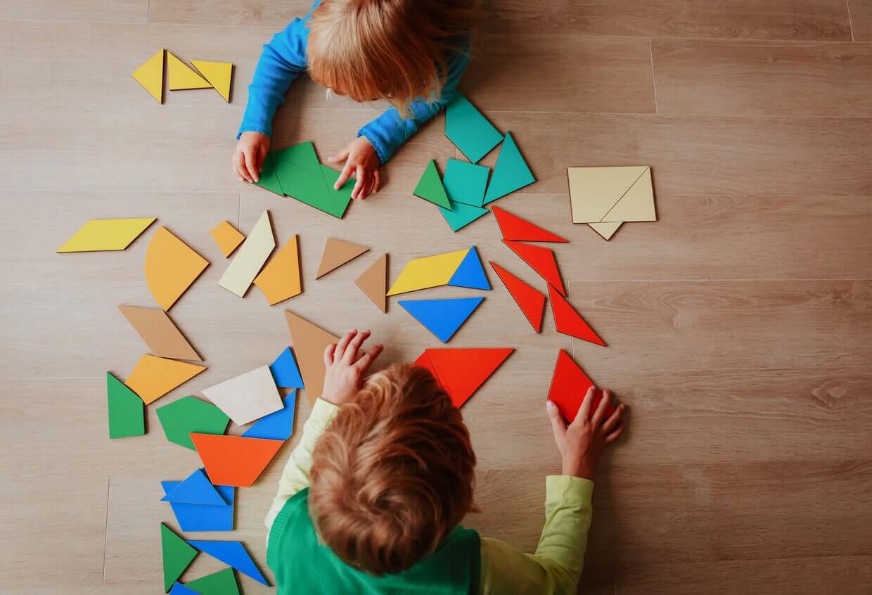 Young children playing with tangrams.