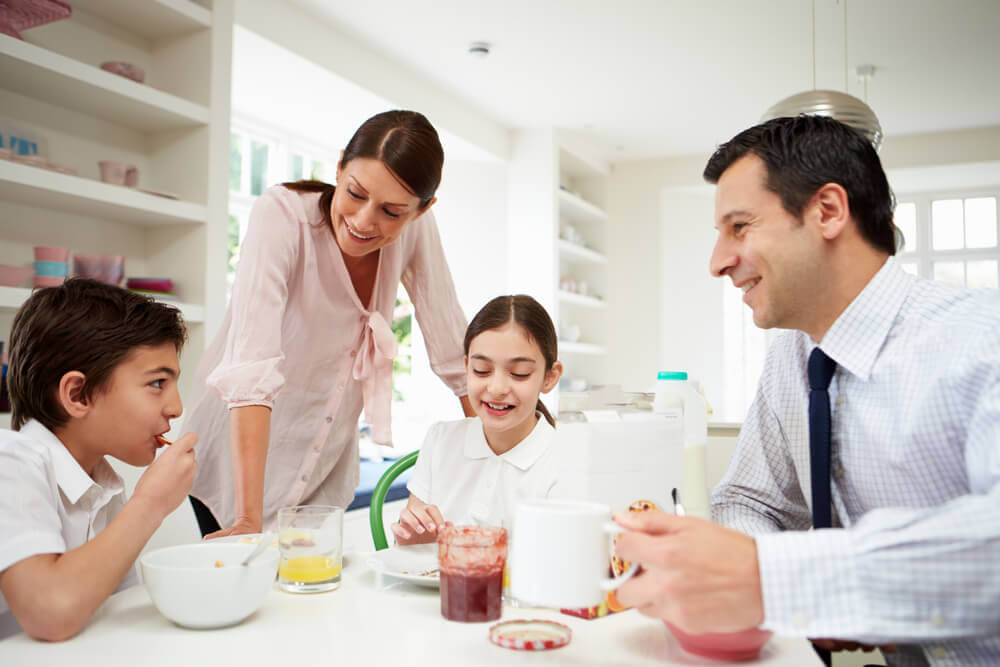 A famiy enjoying breakfast together.