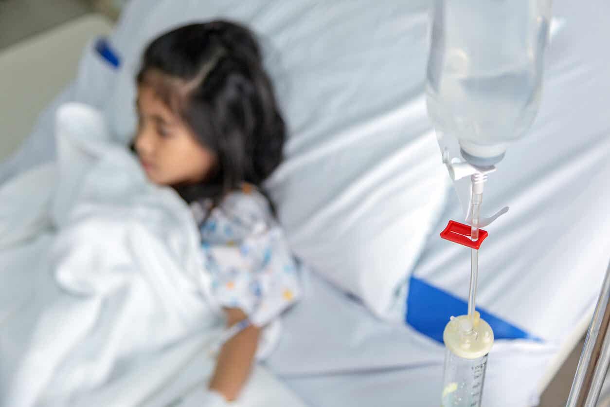 A young girl connected to an IV.