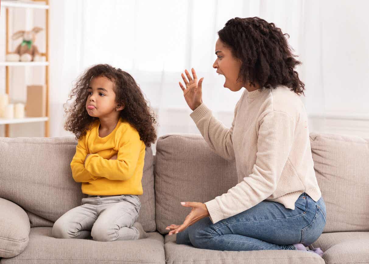 A mother screaming at her young daugther.