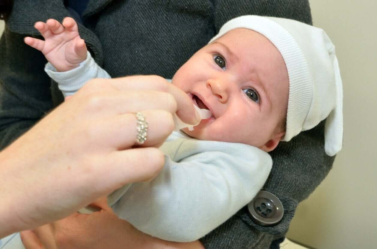 A baby receiving the rotavirus vaccine.
